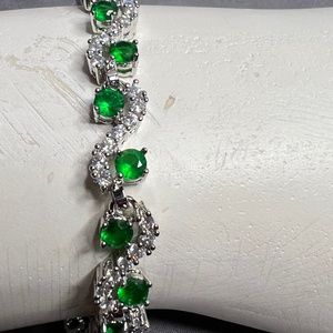 Silver toned infinity style bracelet. Beautifully crafted.